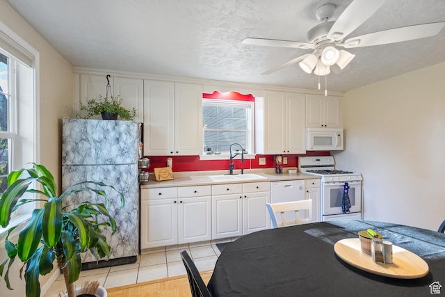 331 W 200 N, Delta, UT 84624 - kitchen featuring white appliances, a ceiling fan, a sink, light countertops, and white cabinets