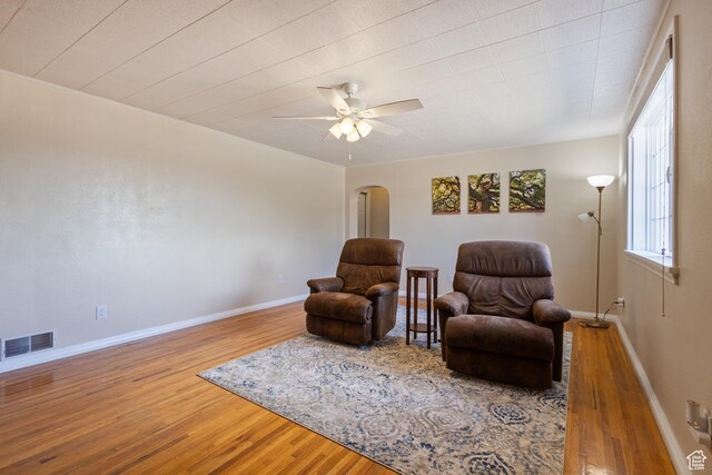 331 W 200 N, Delta, UT 84624 - living area featuring visible vents, a ceiling fan, wood finished floors, arched walkways, and baseboards