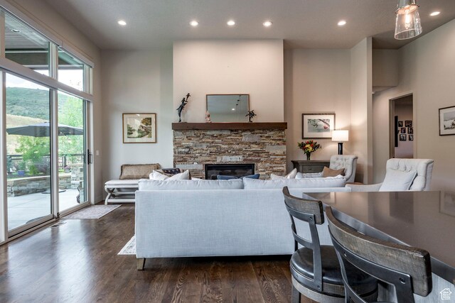 626 Thorn Creek Dr, Kamas, UT 84036 - living room with dark wood-type flooring, recessed lighting, and a stone fireplace