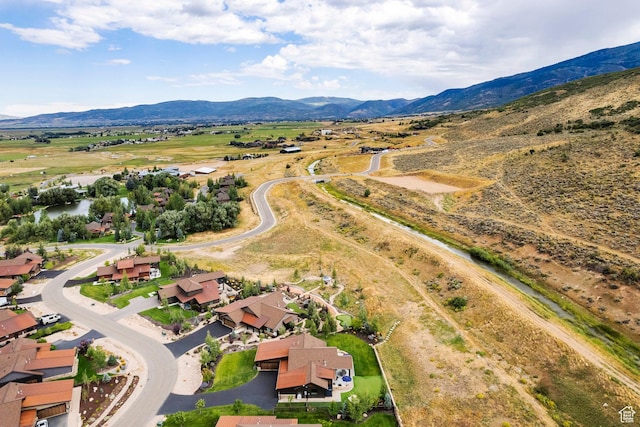 birds eye view of property featuring a mountain view