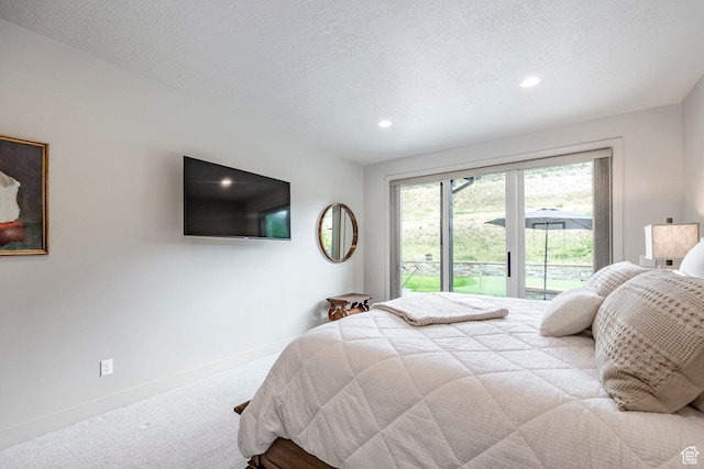carpeted bedroom with recessed lighting, access to exterior, and baseboards