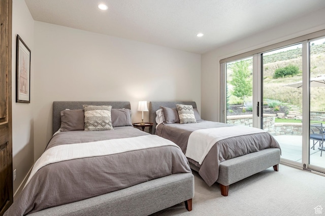 bedroom featuring light carpet, multiple windows, access to exterior, and recessed lighting