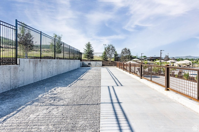 view of community with fence