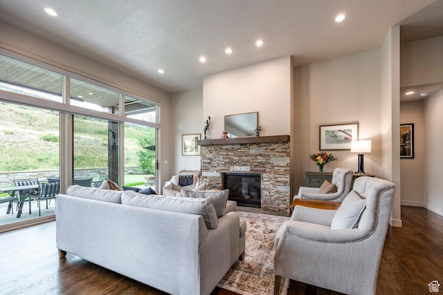 living room with a fireplace, baseboards, dark wood-style floors, and recessed lighting