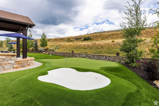 view of yard with view of golf course