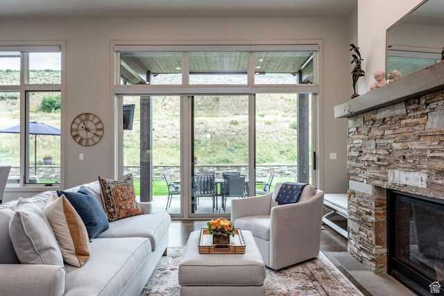 626 Thorn Creek Dr, Kamas, UT 84036 - living room featuring a stone fireplace and healthy amount of natural light