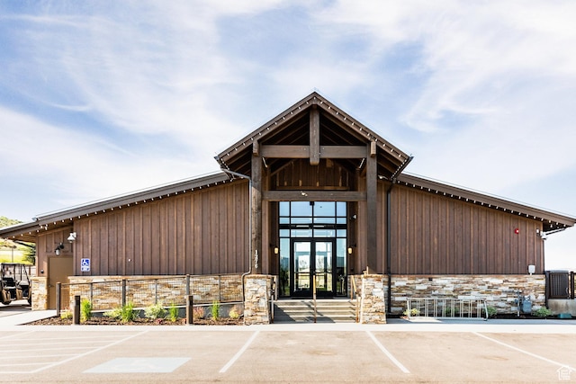 view of property featuring uncovered parking