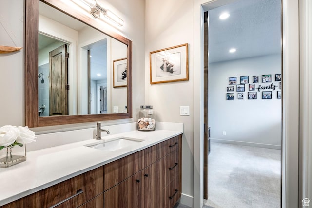 bathroom featuring vanity and recessed lighting