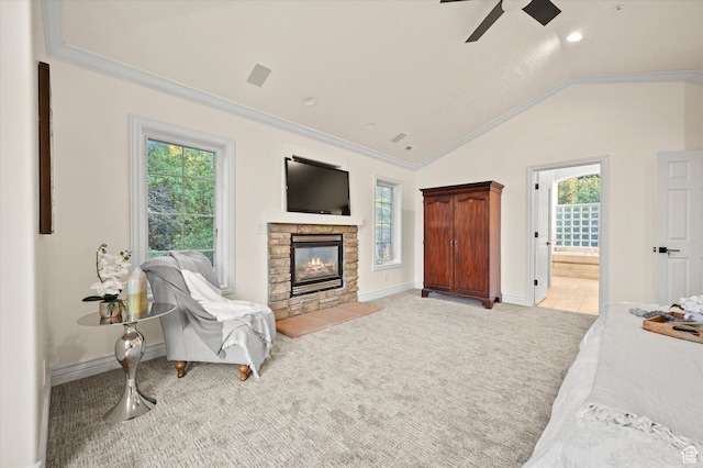 living area with light colored carpet, vaulted ceiling, ornamental molding, and a ceiling fan