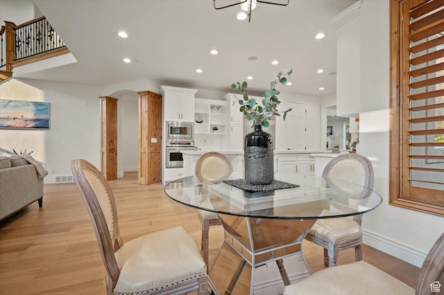dining room with recessed lighting, baseboards, visible vents, and light wood-type flooring