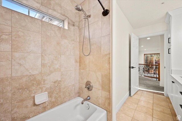 bathroom featuring plenty of natural light, shower / washtub combination, tile patterned flooring, and vanity