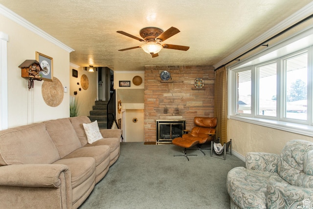 living area featuring a fireplace, crown molding, stairway, carpet flooring, and a textured ceiling