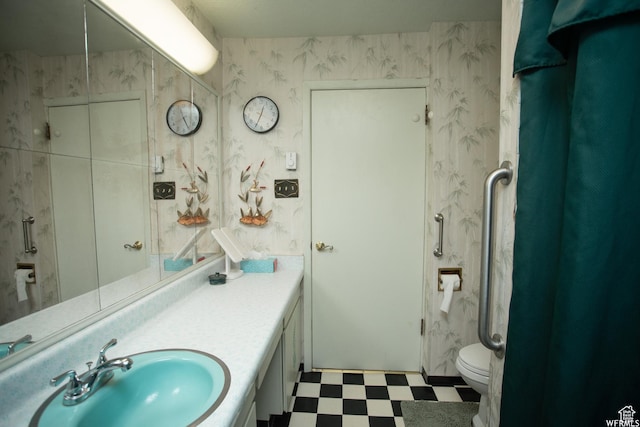 full bath featuring wallpapered walls, vanity, toilet, and tile patterned floors