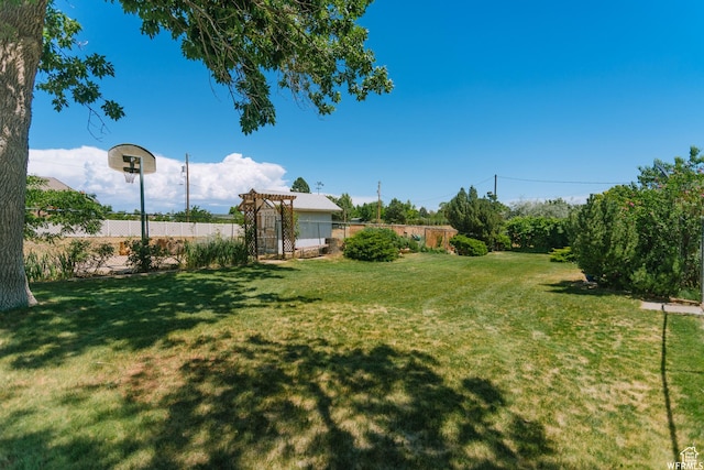 view of yard with fence