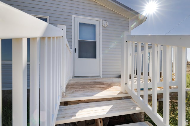 property entrance with a deck