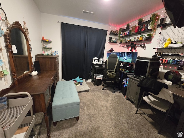 home office featuring visible vents and carpet flooring