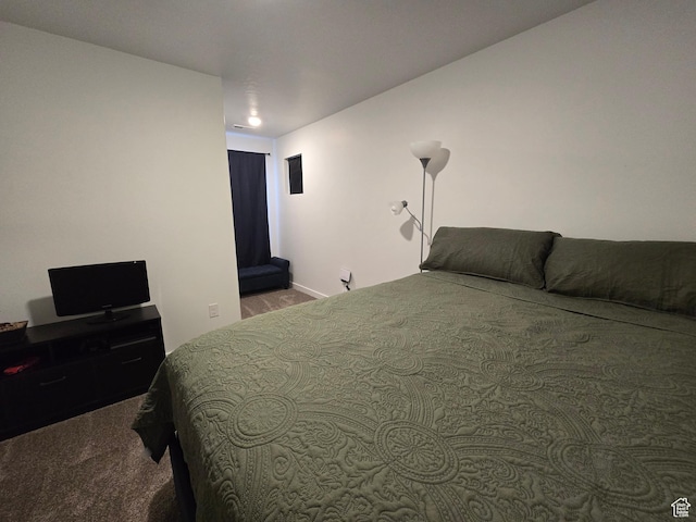 carpeted bedroom with baseboards