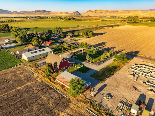 birds eye view of property with a mountain view and a rural view