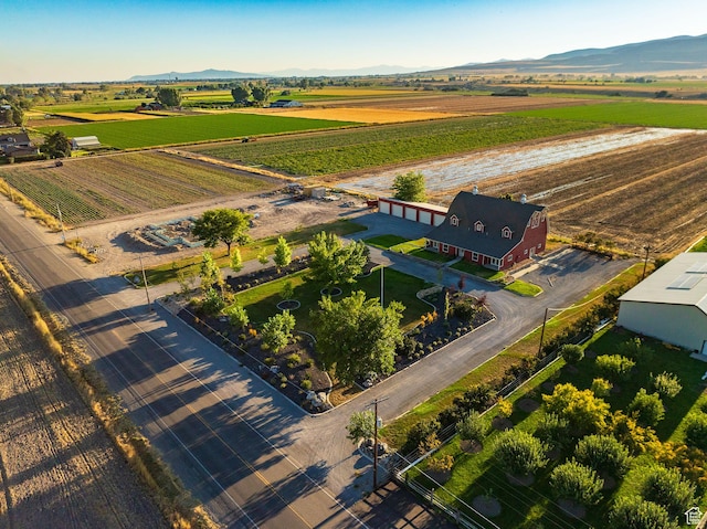 birds eye view of property with a mountain view and a rural view