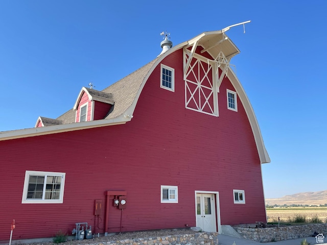 view of side of property with an outbuilding and a barn