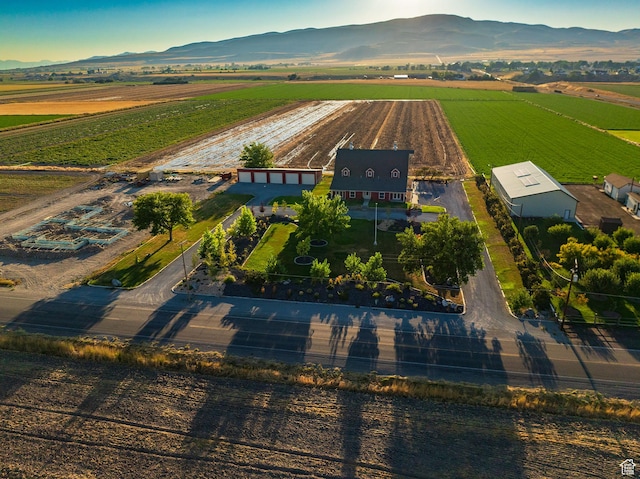 birds eye view of property with a mountain view and a rural view