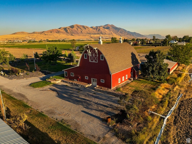 bird's eye view with a mountain view and a rural view