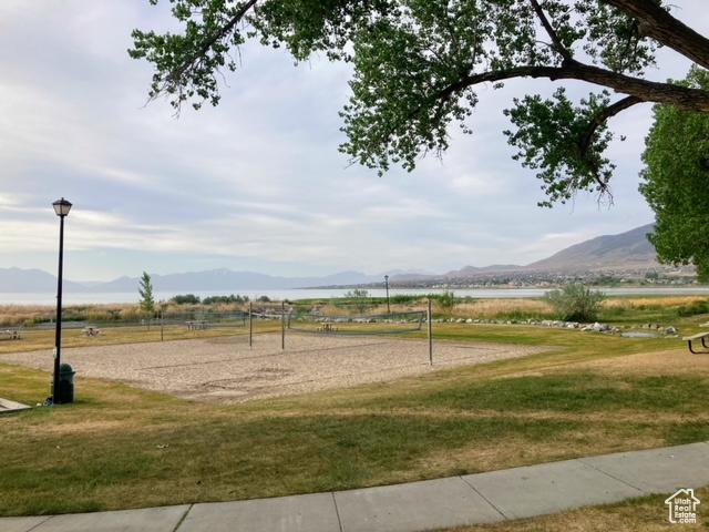 2118 S Centennial Blvd S, Saratoga Springs, UT 84045 - view of property's community with volleyball court, a mountain view, and a lawn