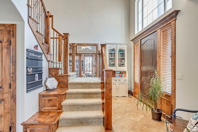 2118 S Centennial Blvd S, Saratoga Springs, UT 84045 - stairway with a towering ceiling and tile patterned flooring