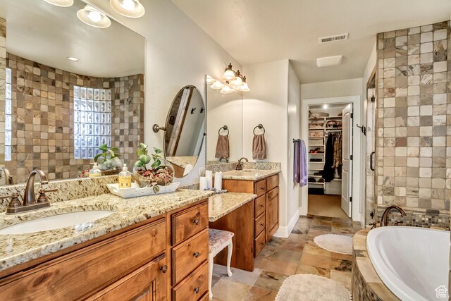 2118 S Centennial Blvd S, Saratoga Springs, UT 84045 - full bath with a garden tub, two vanities, tile walls, and a spacious closet