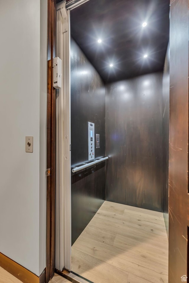 room details featuring elevator and recessed lighting