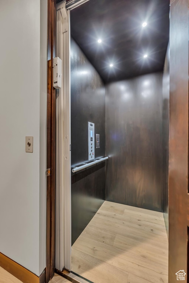 room details with elevator and recessed lighting