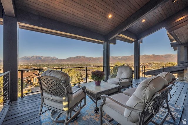 deck with outdoor lounge area and a mountain view