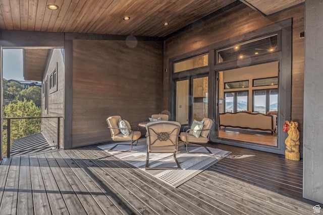 wooden deck featuring outdoor dining space