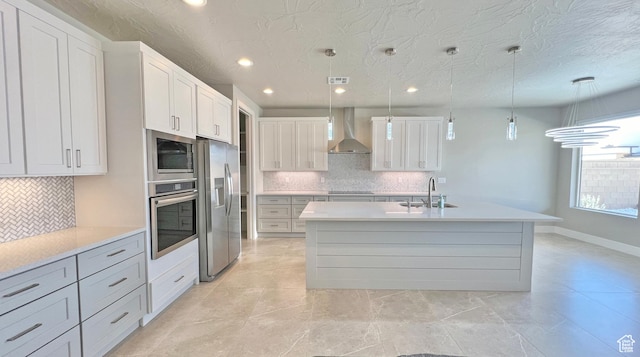 5178 W 2150 S, Hurricane, UT 84737 - kitchen with appliances with stainless steel finishes, wall chimney range hood, a sink, tasteful backsplash, and recessed lighting