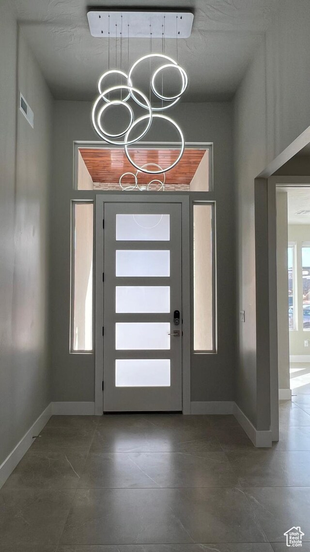 5178 W 2150 S, Hurricane, UT 84737 - entrance foyer with a chandelier, baseboards, and tile patterned floors