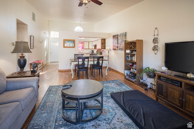 592 W Hale Ave, Moab, UT 84532 - living area with a ceiling fan, wood finished floors, and baseboards