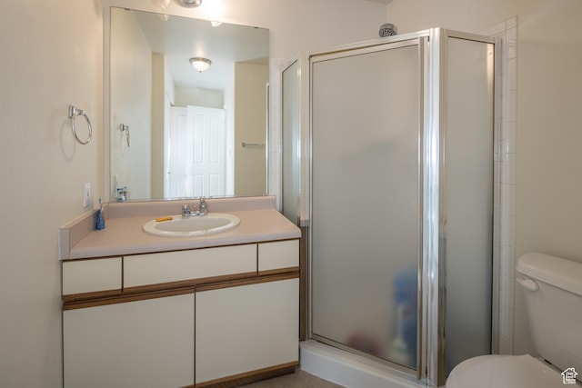 592 W Hale Ave, Moab, UT 84532 - full bathroom featuring a shower stall, toilet, and vanity