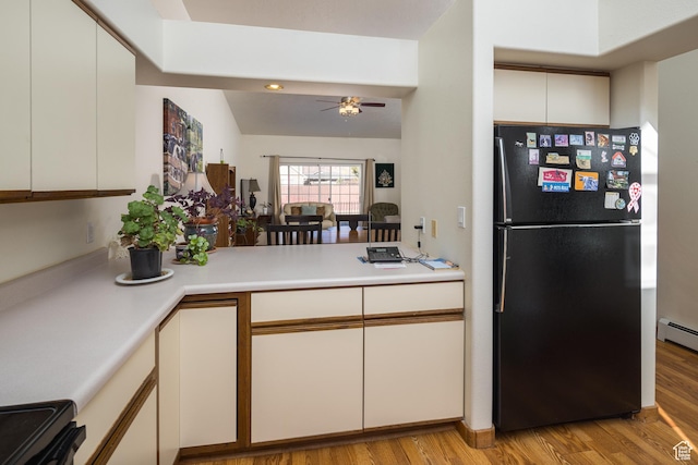 592 W Hale Ave, Moab, UT 84532 - kitchen featuring freestanding refrigerator, light wood-style floors, light countertops, and electric stove