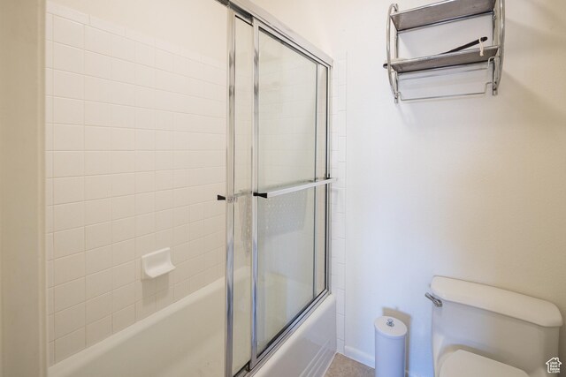 592 W Hale Ave, Moab, UT 84532 - full bath with shower / bath combination with glass door and toilet
