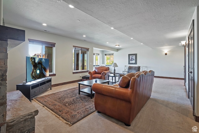 1375 E Lasso Trl, Hideout, UT 84036 - living room featuring a fireplace, a textured ceiling, and carpet