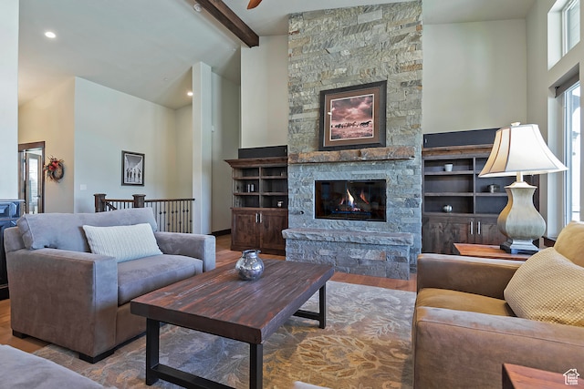 1375 E Lasso Trl, Hideout, UT 84036 - living room with high vaulted ceiling, wood-type flooring, beamed ceiling, and a stone fireplace