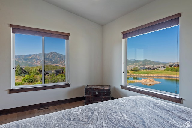 1375 E Lasso Trl, Hideout, UT 84036 - bedroom featuring wood-type flooring and a water and mountain view