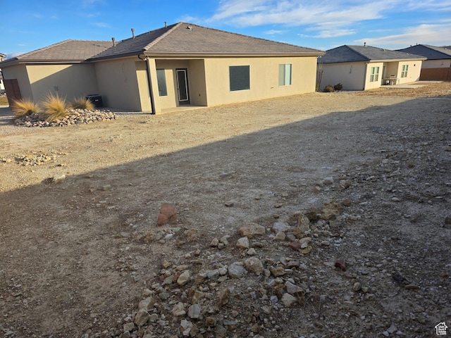 back of house with stucco siding