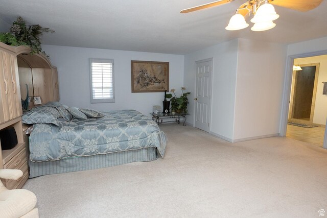 bedroom with baseboards, a ceiling fan, and light colored carpet