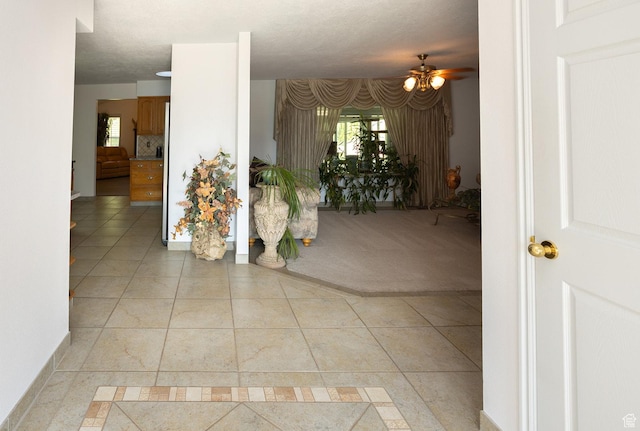corridor with light tile patterned flooring