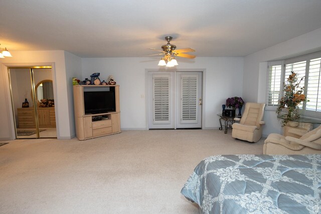 bedroom with baseboards, access to outside, carpet, and a ceiling fan