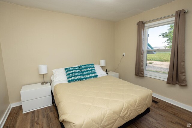 566 S Main St, Lyman, UT 84749 - bedroom with wood finished floors and baseboards