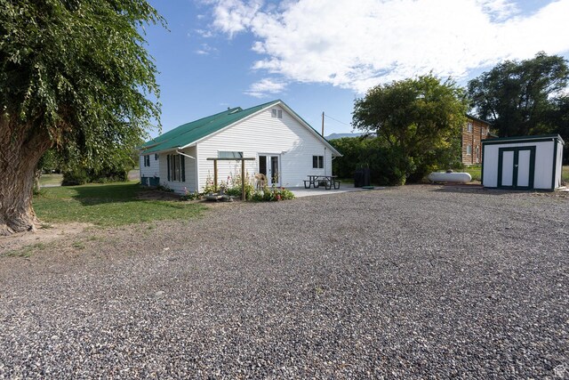 566 S Main St, Lyman, UT 84749 - view of front of home featuring driveway and a patio area
