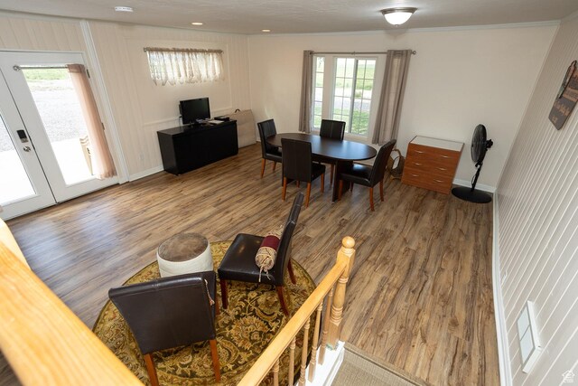 566 S Main St, Lyman, UT 84749 - dining space with wood finished floors, healthy amount of natural light, baseboards, and ornamental molding