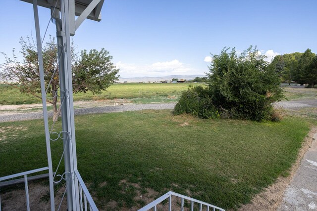 566 S Main St, Lyman, UT 84749 - view of grassy yard featuring a view of rural / pastoral area